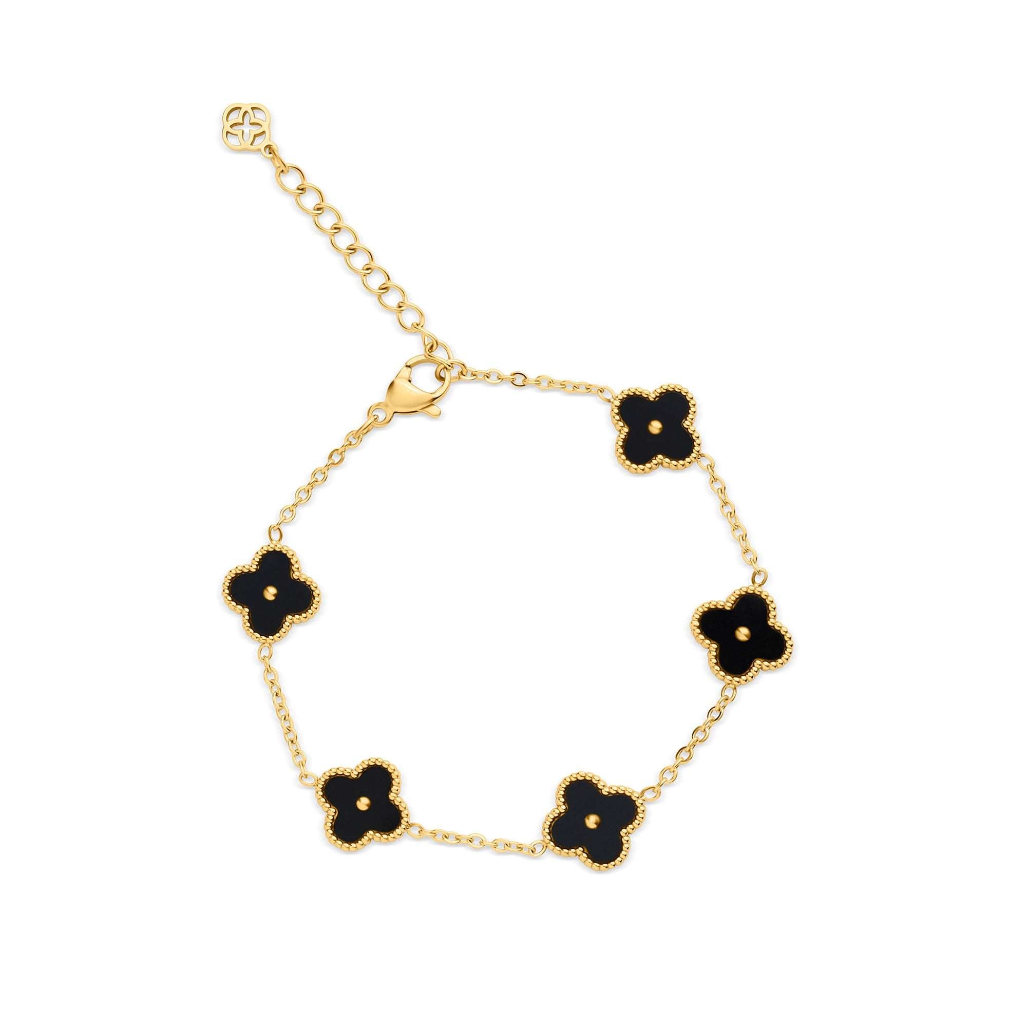 Apzeltīta rokassprādze ar melniem četrulapīšiem