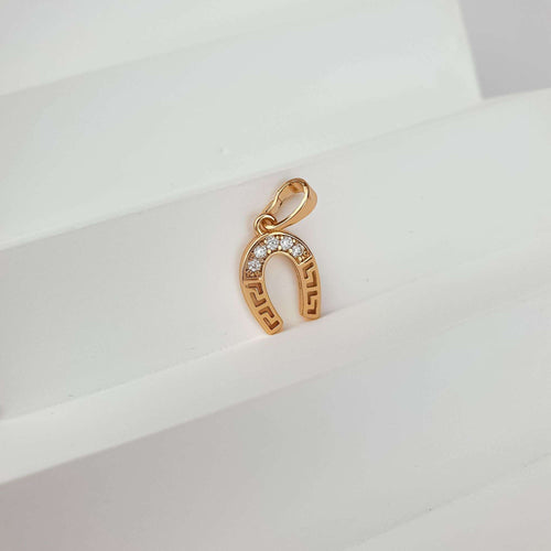 Kulons pakavas formā ar dzidriem kristāliem zelta krāsā