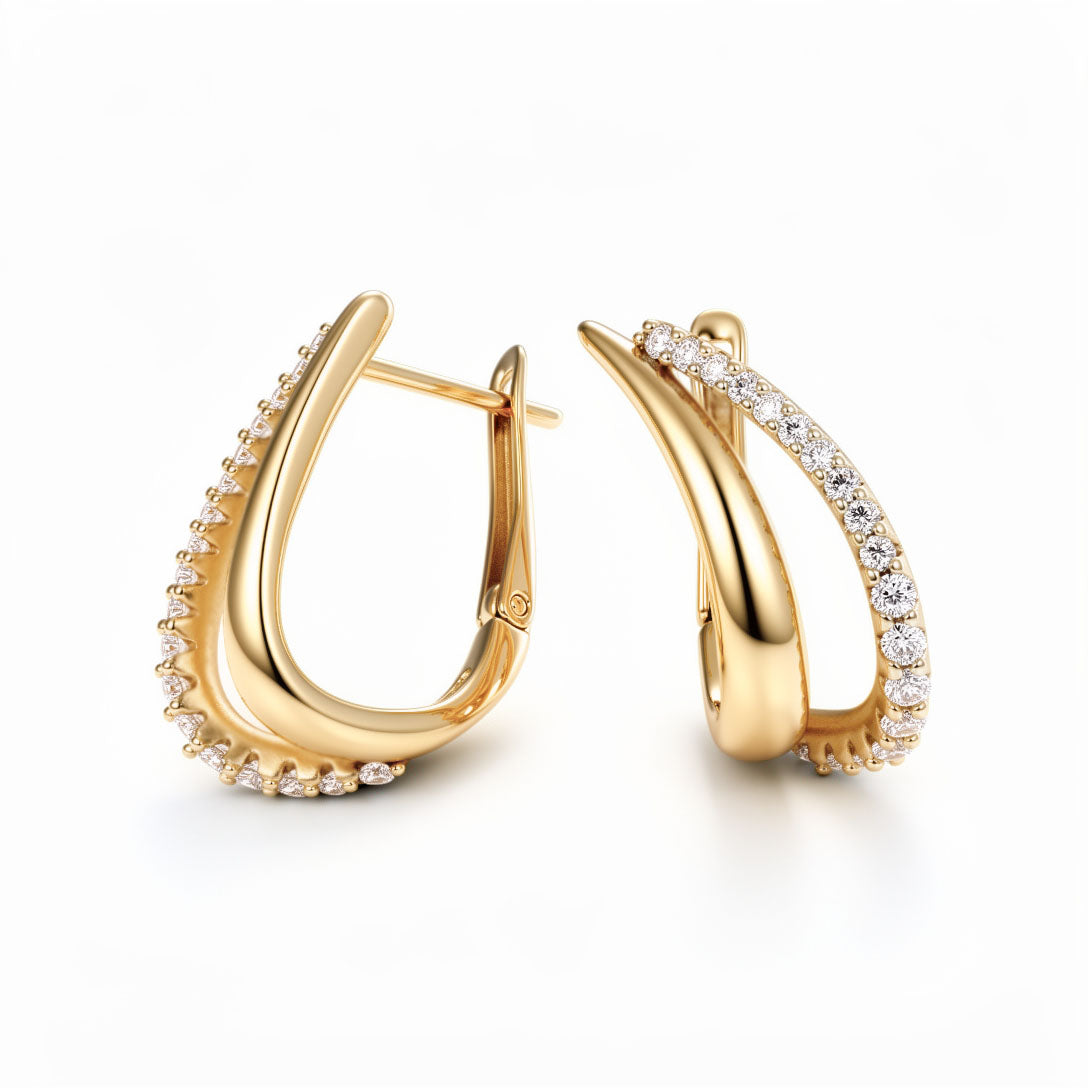 Apzeltīti loku auskari ar cirkoniem un krustenisku dizainu